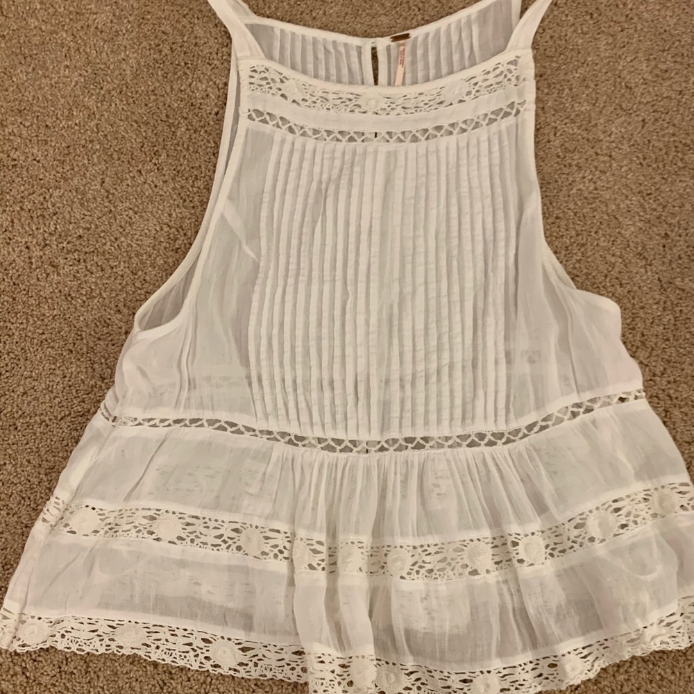White sleeveless blouse